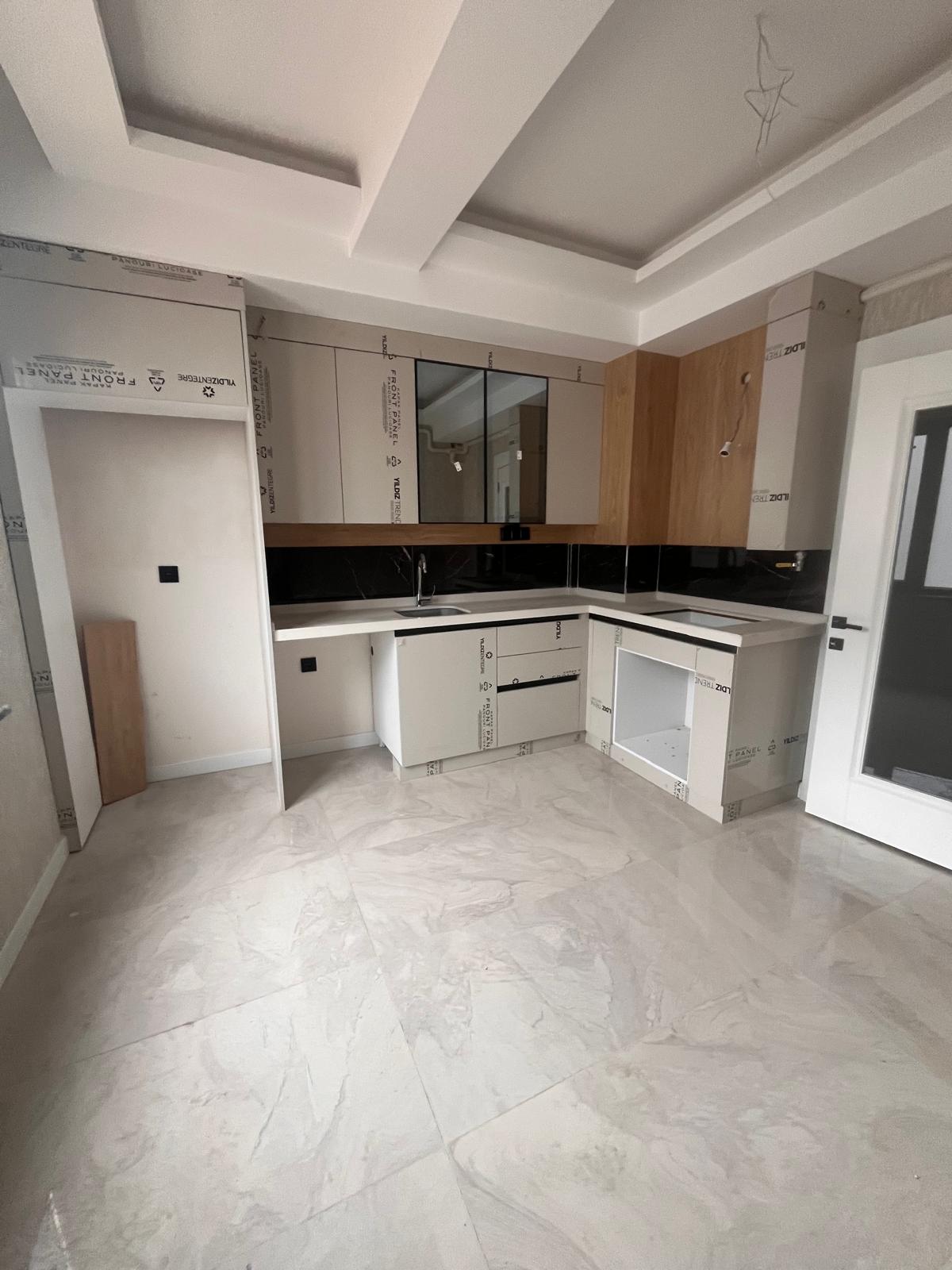 M.FEVZİ ÇAKMAK MAHALLESİNDE ARA KAT SİTE İÇİNDE SATILIK DAİRE 33